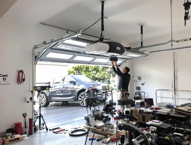 Orange Garage Door Repair specialist installing smart garage door opener system in Orange home